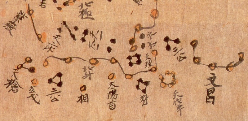A star map on silk, depicting stars as dots connected into patterns with lines, annotated in classical Chinese calligraphy.